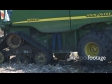 Man Fixing Harvestor 1546